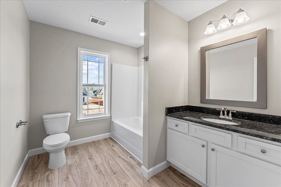 Representative furnished interior of a home built from the Sumter by Enchanted Homes in Lonesome Dove, San Antonio (Image 12).