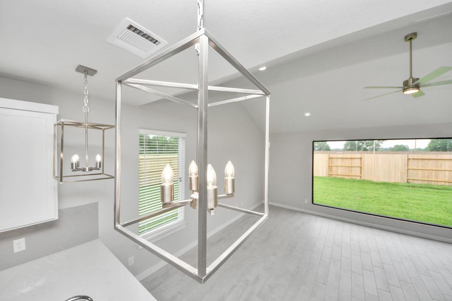 All of this overlooks your expansive family room, creating a perfect space for culinary delights and family gatherings. Sample photo of completed home with similar floor plan. Actual colors and selections may vary. All of this overlooks your expansive family room, creating a perfect space for culinary delights and family gatherings. Sample photo of completed home with similar floor plan. Actual colors and selections may vary.