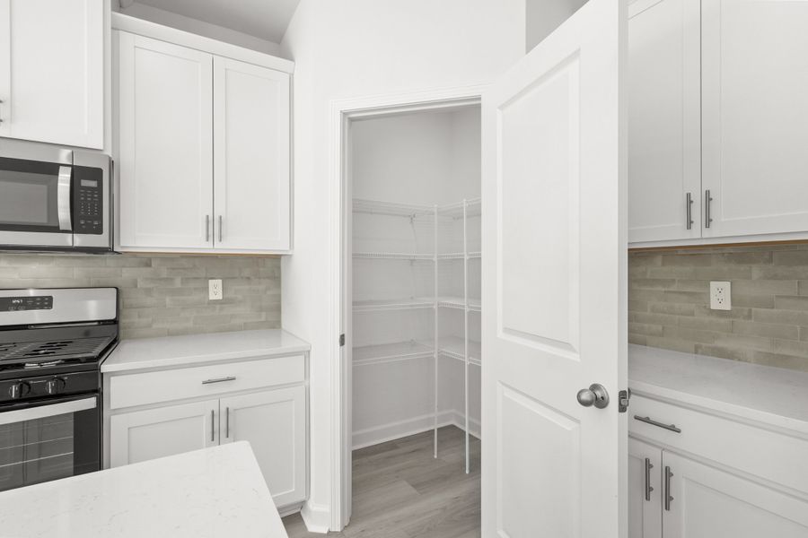 Furnished interior view inside a new home in Cypress Ridge - The Boardwalk Series, Longs (Image 12).