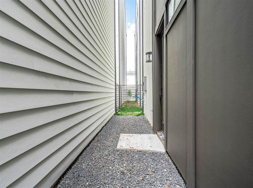 Fully gated outdoor space in the side of the home.