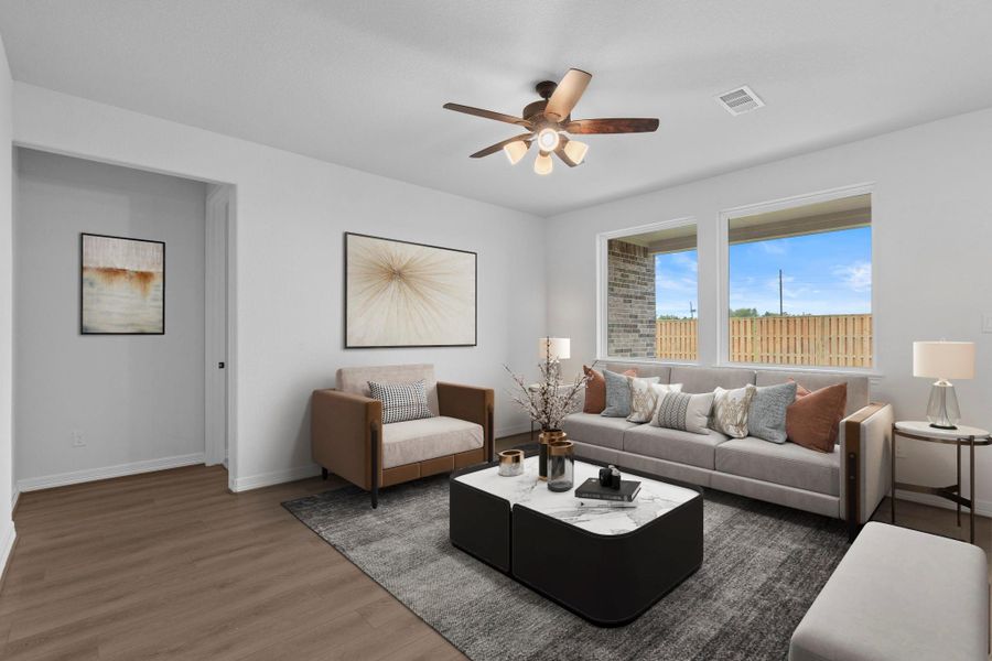 Your family room has ample space to entertain family and friends. This space features beautiful floors, fresh paint, ceiling fan with lighting, and high ceilings.