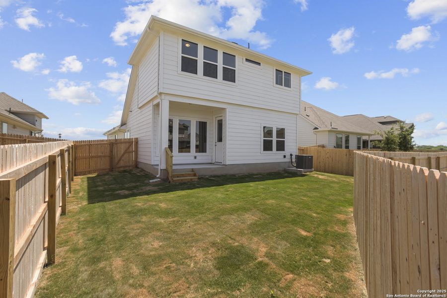 Front exterior of a new home in Rhine Valley, Schertz, TX, highlighting curb appeal (Image 1).