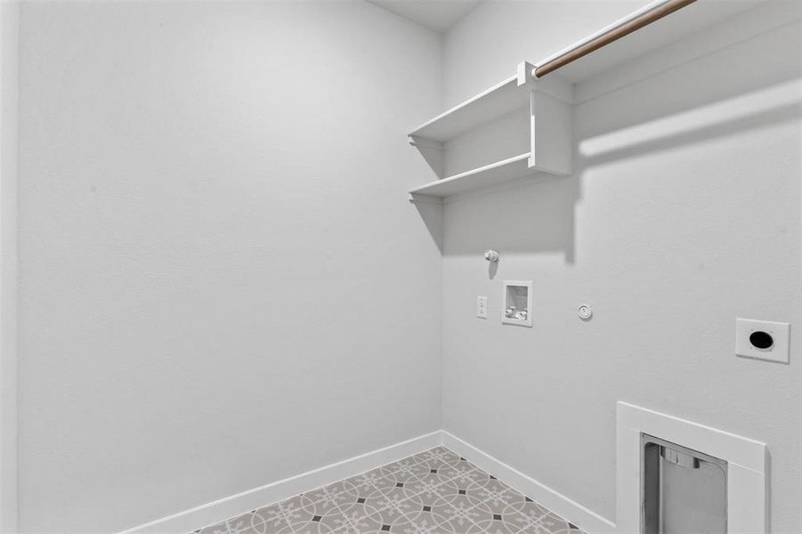 Laundry room featuring tile flooring, washer hookup, electric dryer hookup, and hookup for a gas dryer