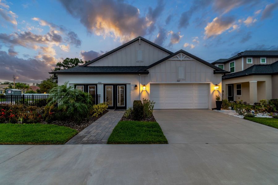 Representative exterior photo of a completed home built from the Sandpiper by William Ryan Homes in Fairway Pointe - 55+ Villa Community, Sun City Center, FL (Image 22).