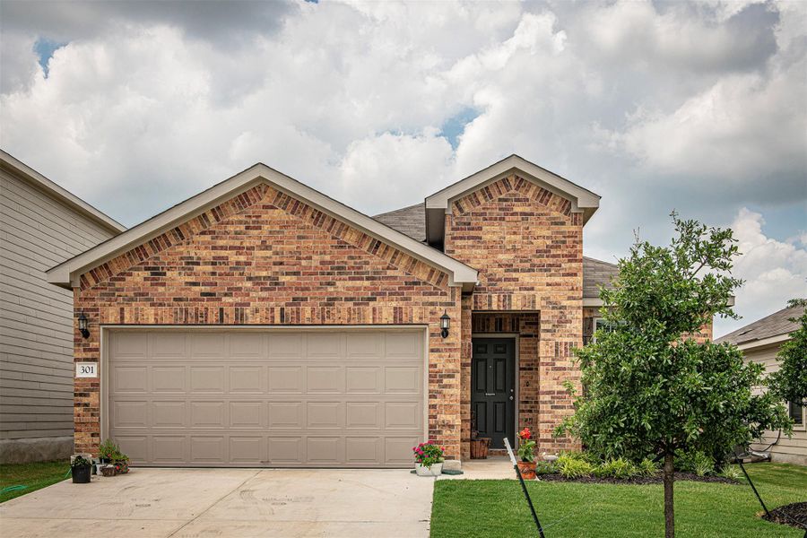 Front exterior of a new home in Sonterra, Jarrell, TX, highlighting curb appeal (Image 2). Front exterior of a new home in Sonterra, Jarrell, TX, highlighting curb appeal (Image 2).