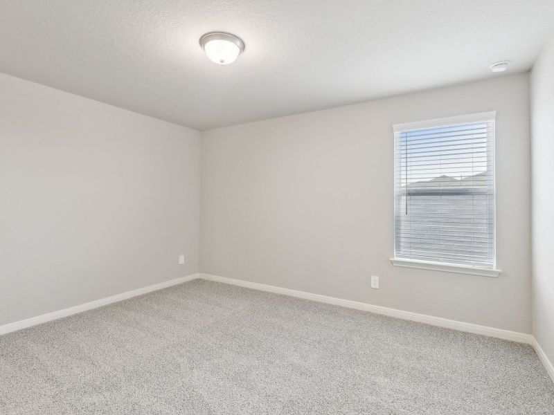 Guest bedroom in the San Jacinto floorplan at a Meritage Homes community.