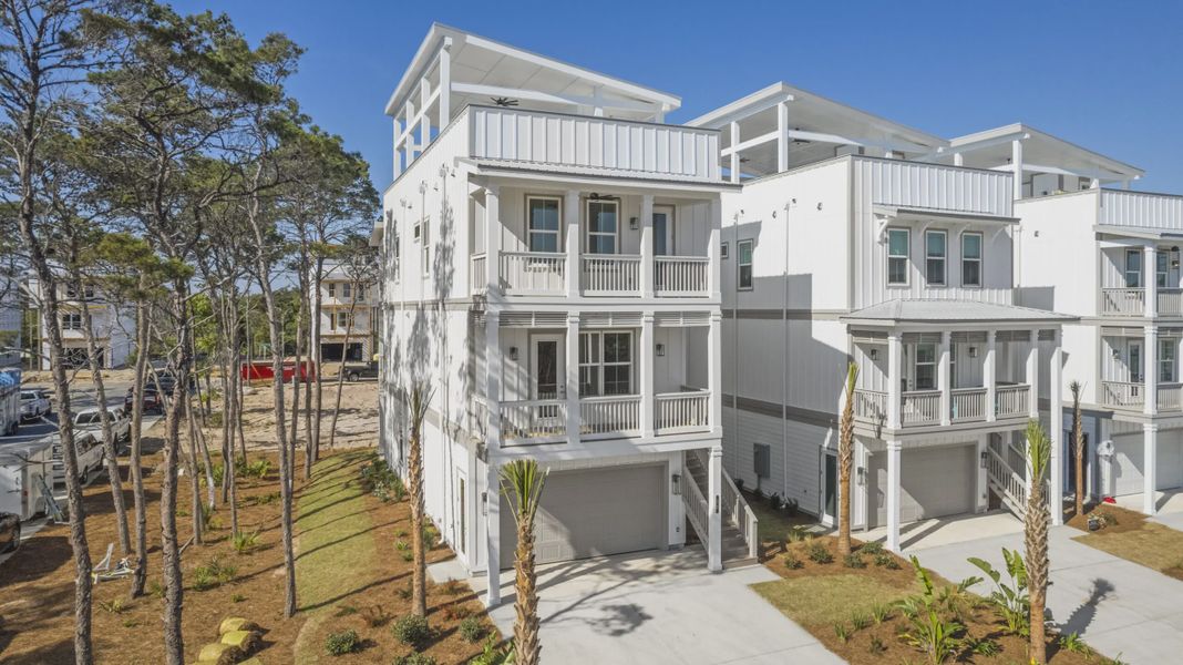 Front exterior of a new home in Twin Palms, Inlet Beach, FL, highlighting curb appeal (Image 1). Front exterior of a new home in Twin Palms, Inlet Beach, FL, highlighting curb appeal (Image 1).