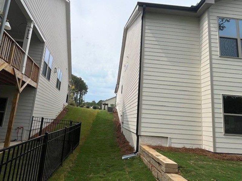 Exterior details and patio area of a home in Soleil Belmont Park, Canton (Image 2). Exterior details and patio area of a home in Soleil Belmont Park, Canton (Image 2).