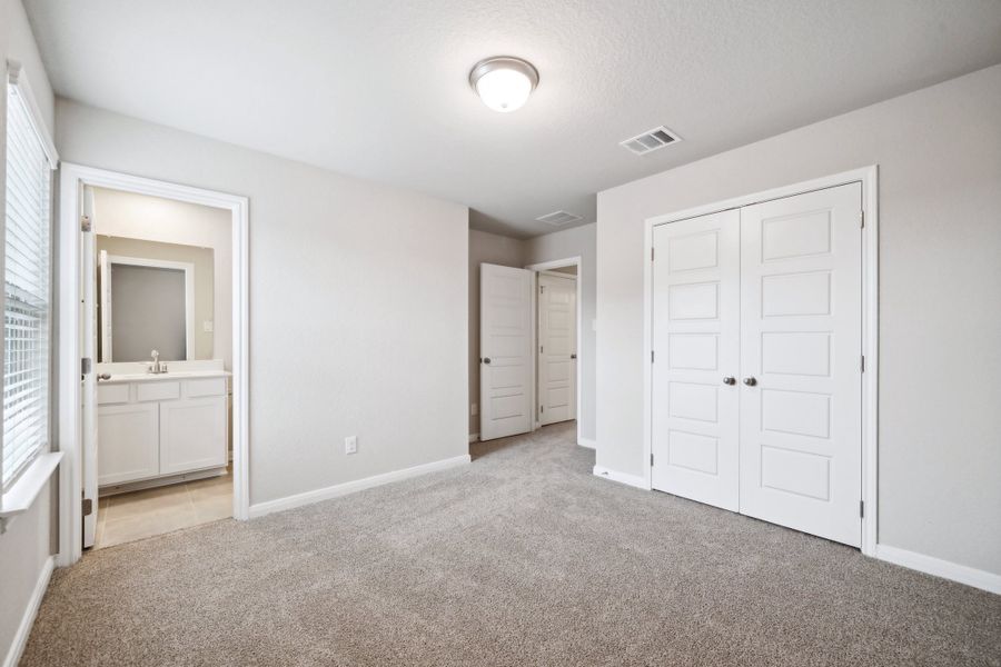 Guest bedroom in the Reynolds floorplan at a Meritage Homes community.