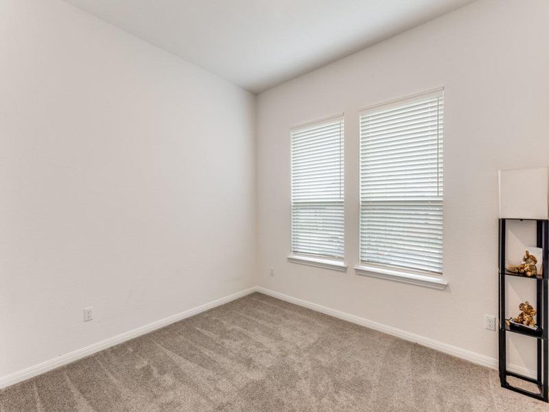 This front bedroom sits near a full bathroom and is perfect for guests (or a home office that doesn’t feel like it’s in the middle of everything).