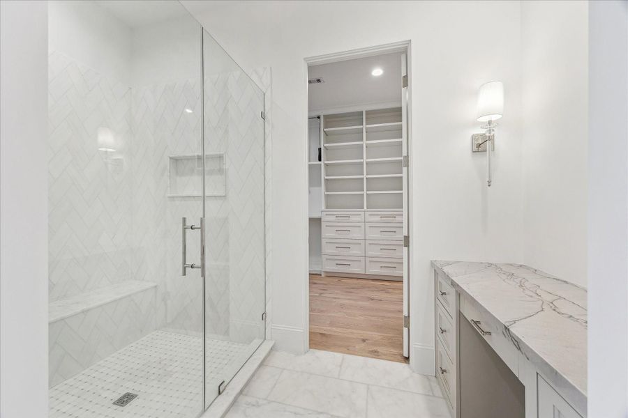 Second vanity space also has an oversized mirror and additional storage.