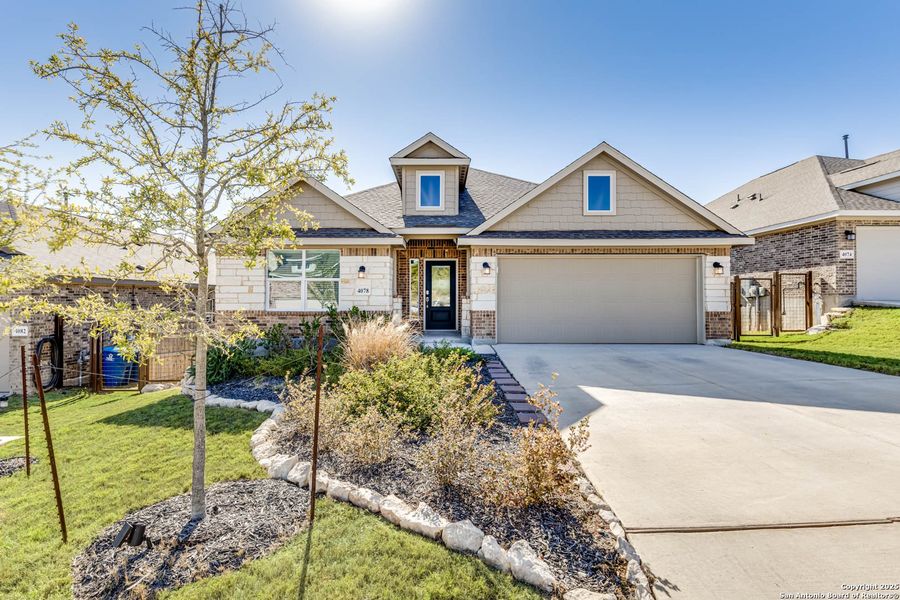 Front exterior of a new home in Johnson Ranch: Brookstone II Collection, Bulverde, TX, highlighting curb appeal (Image 1).