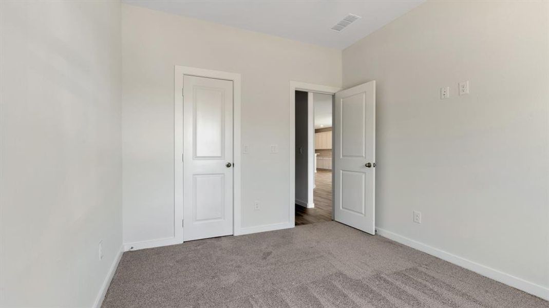 Unfurnished bedroom featuring carpet