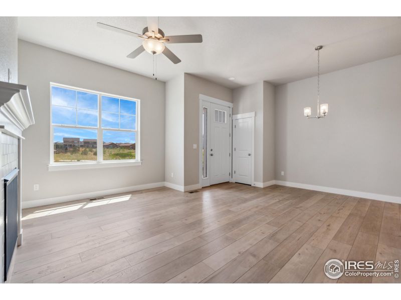 Upgraded extended luxury vinyl throughout the living room & dining nook.