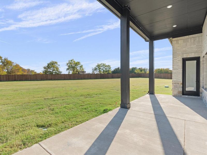 Fenced backyard with a patio Fenced backyard with a patio