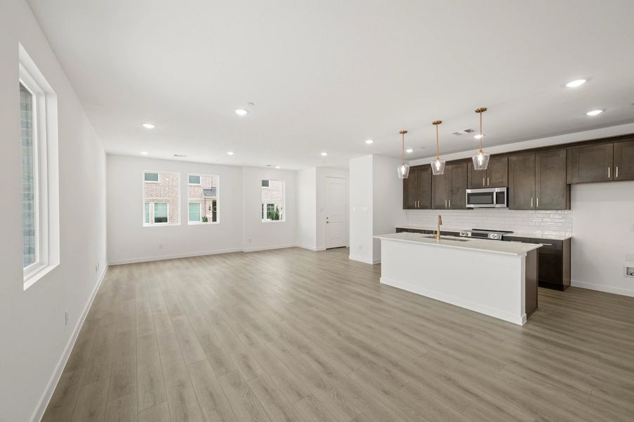 Open Kitchen-Living-Dining Room featuring the Oxford Collection