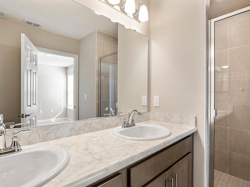 Your suite is complete with a private en-suite bath and a walk-in wardrobe - Daisy townhome by Highland Homes