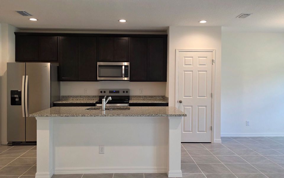 Furnished interior view inside a new home in Blue Springs Reserve Townhomes, Groveland (Image 5). Furnished interior view inside a new home in Blue Springs Reserve Townhomes, Groveland (Image 5).
