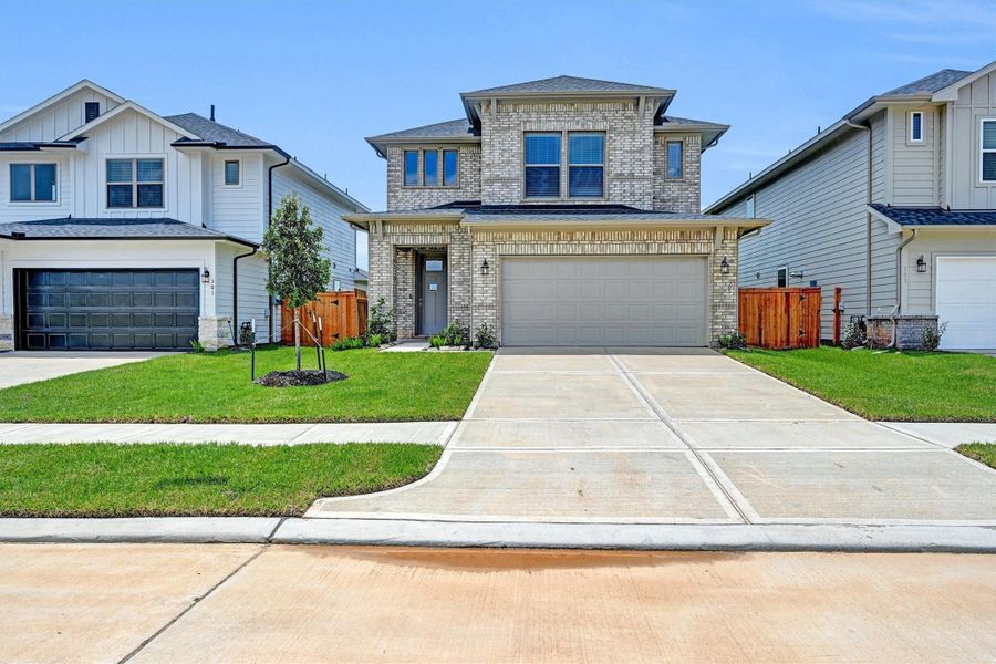 Front exterior of a new home in La Segarra 40', Brookshire, TX, highlighting curb appeal (Image 19).