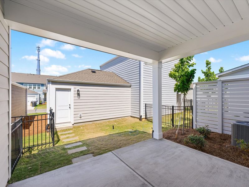Exterior details and patio area of a home in North Creek Village - Townhomes, Huntersville (Image 4).