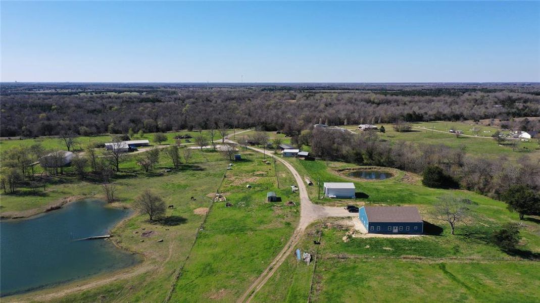 Drone / aerial view featuring a wooded view, a water view, and a rural view Drone / aerial view featuring a wooded view, a water view, and a rural view