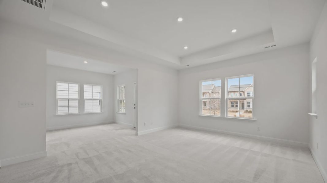 The Brentwood Plan by DRB Homes in River District, Charlotte NC.- Primary Bedroom with Sitting Area The Brentwood Plan by DRB Homes in River District, Charlotte NC.- Primary Bedroom with Sitting Area