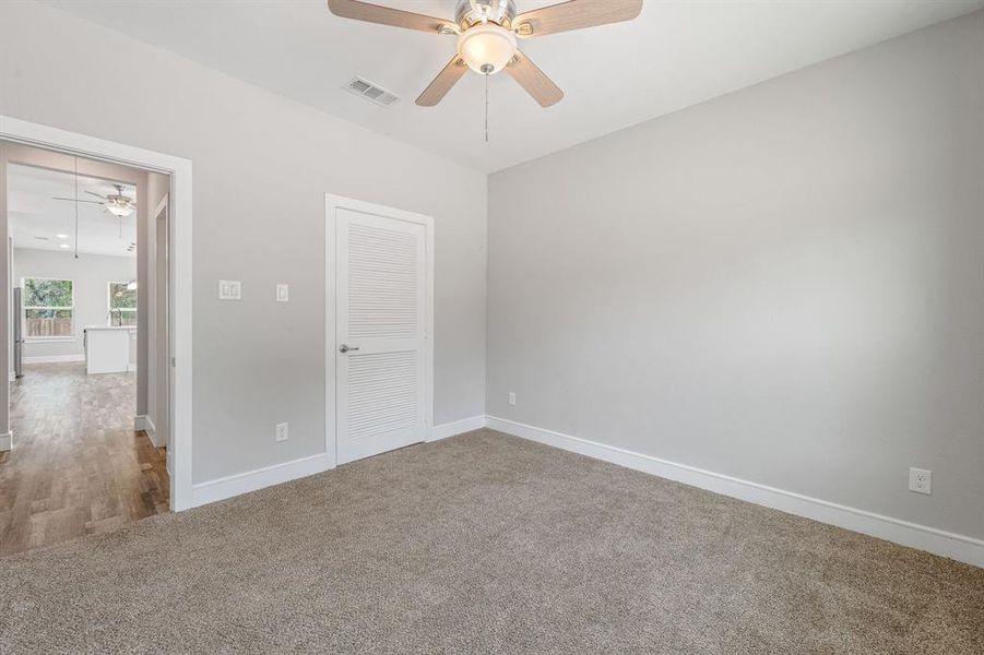 Unfurnished bedroom featuring carpet, a closet, and ceiling fan Unfurnished bedroom featuring carpet, a closet, and ceiling fan