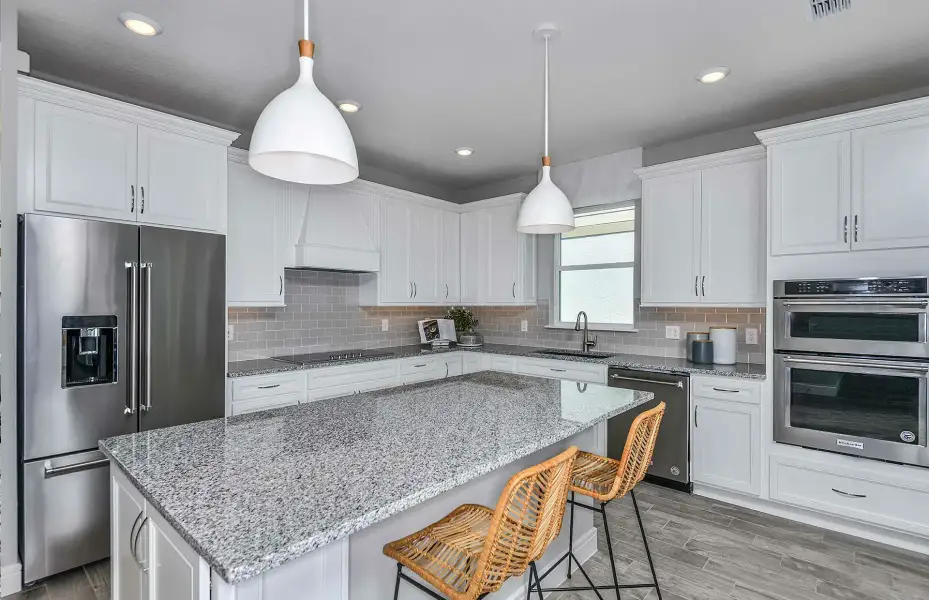 Representative furnished interior of a home built from the Monroe by Pulte Homes in Stonehill, Howey-in-the-Hills (Image 5).