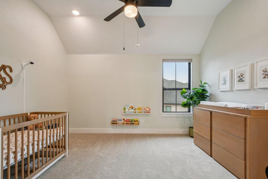 Spacious room featuring vaulted ceilings, recessed lighting, a ceiling fan, and carpeted flooring Spacious room featuring vaulted ceilings, recessed lighting, a ceiling fan, and carpeted flooring