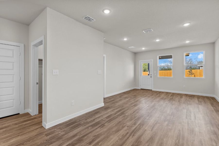 A room with white walls and wood floors. A room with white walls and wood floors.