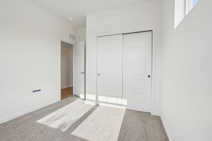 Spacious, unfurnished interior of a new home in Union Colony West, Greeley (Image 32).