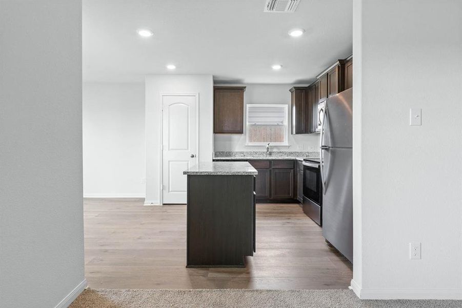 Furnished interior view inside a new home in Retreat at Fossil Creek, Fort Worth (Image 3).