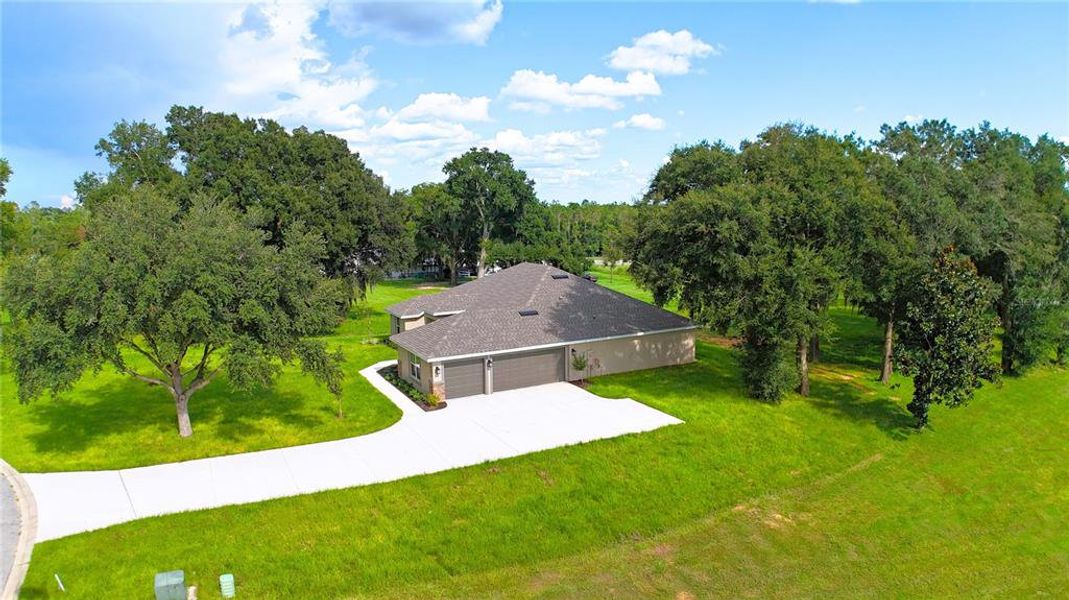 Front exterior of a new home in Hill Country Estates, Dade City, FL, highlighting curb appeal (Image 15). Front exterior of a new home in Hill Country Estates, Dade City, FL, highlighting curb appeal (Image 15).