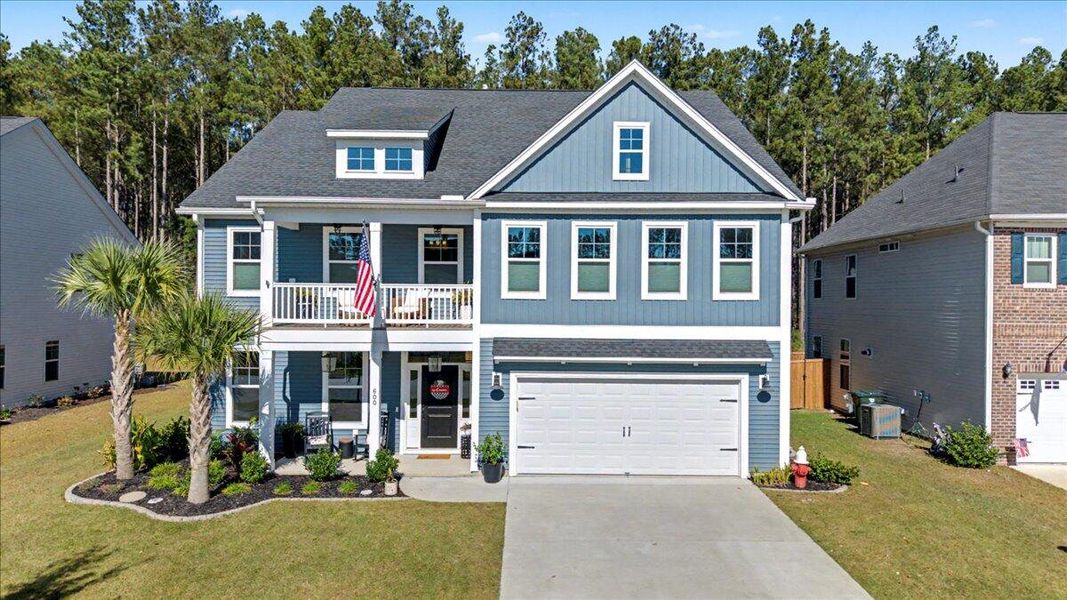 Front exterior of a new home in Hewing Farms, Summerville, SC, highlighting curb appeal (Image 1). Front exterior of a new home in Hewing Farms, Summerville, SC, highlighting curb appeal (Image 1).