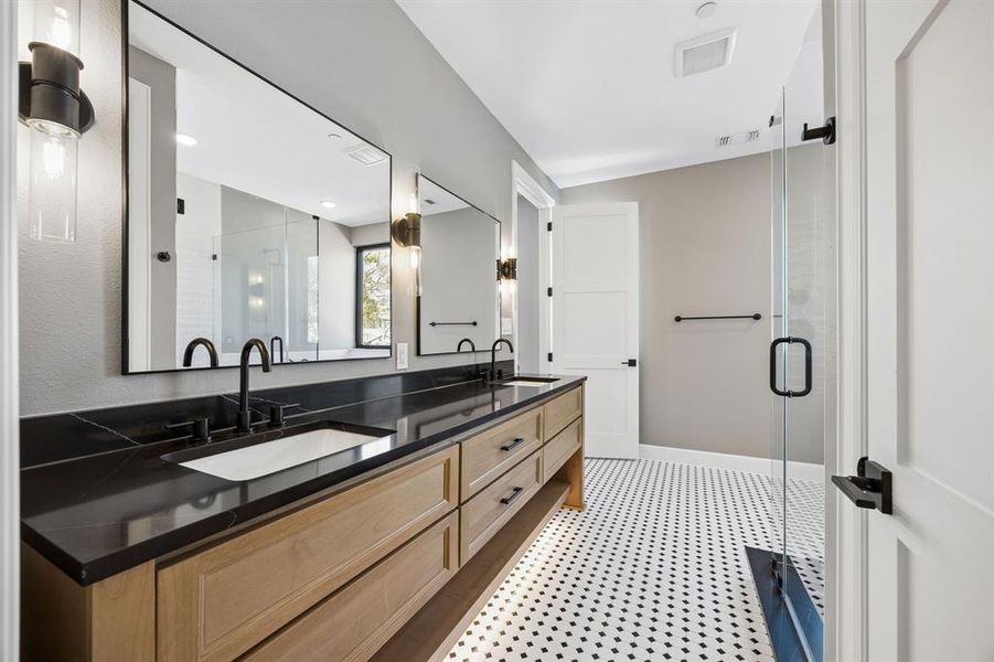 Bathroom with double vanity and a stall shower Bathroom with double vanity and a stall shower