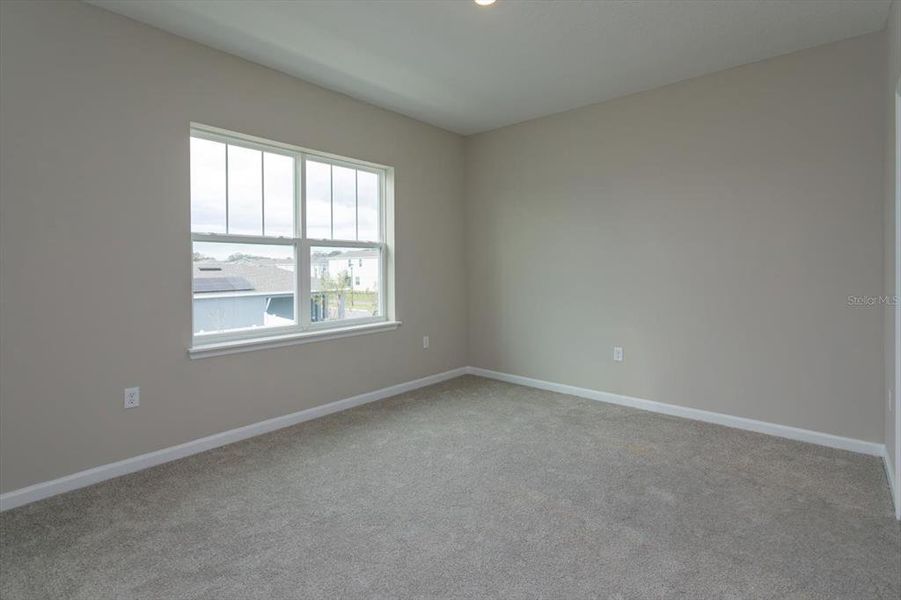Spacious, unfurnished interior of a new home in Serenade at Ovation, Winter Garden (Image 21).