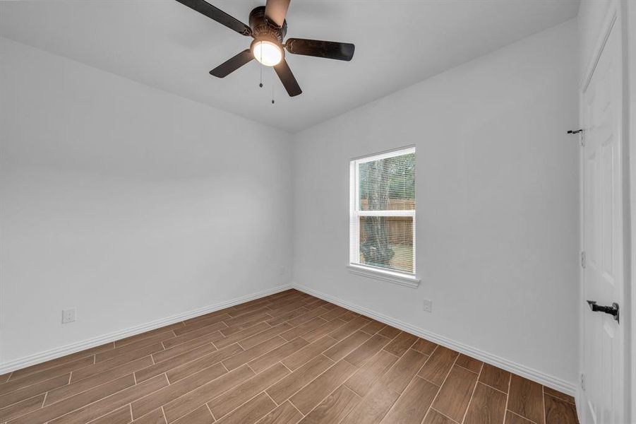 Unfurnished room featuring ceiling fan