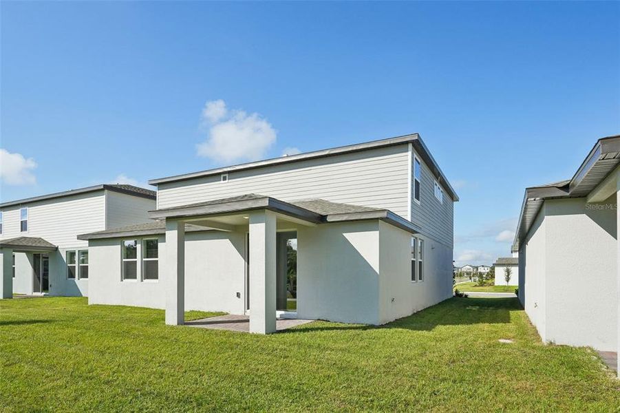 Exterior details and patio area of a home in The Meadow at Crossprairie, St. Cloud (Image 4).