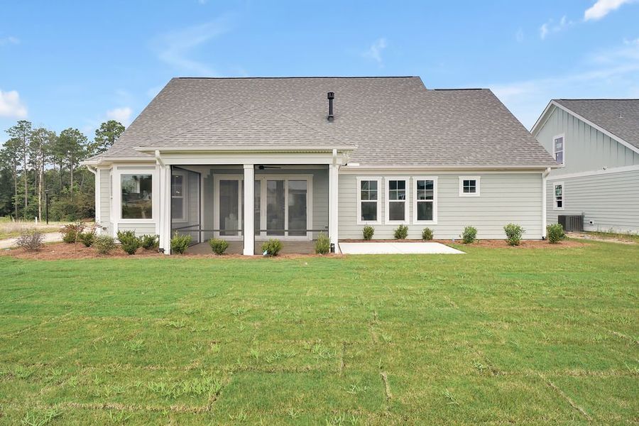 Front exterior of a new home in Brunswick Forest, Leland, NC, highlighting curb appeal (Image 23). Front exterior of a new home in Brunswick Forest, Leland, NC, highlighting curb appeal (Image 23).