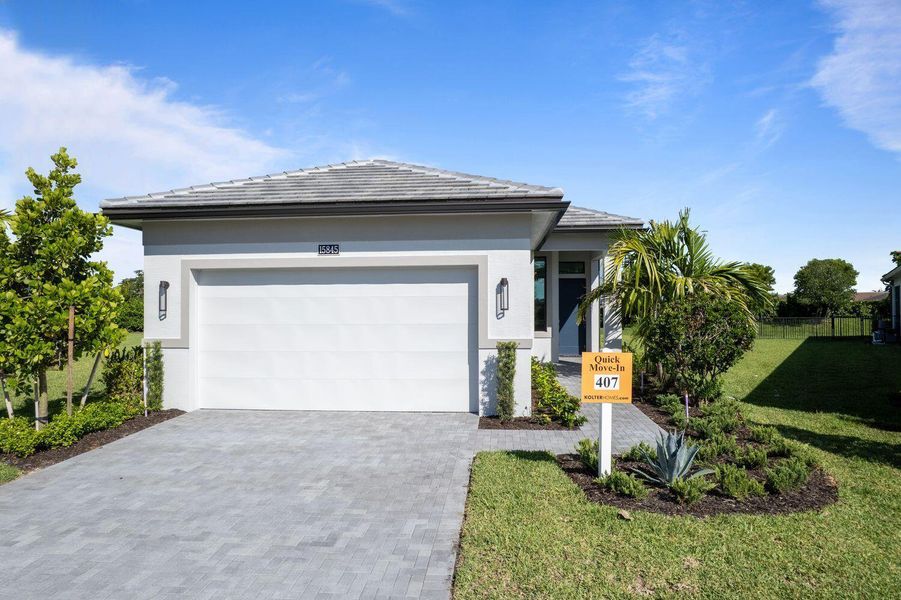Front exterior of a new home in Cresswind Palm Beach at Westlake, Westlake, FL, highlighting curb appeal (Image 1).