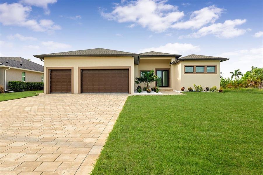 Front exterior of a new home in , Port Charlotte, FL, highlighting curb appeal (Image 26).