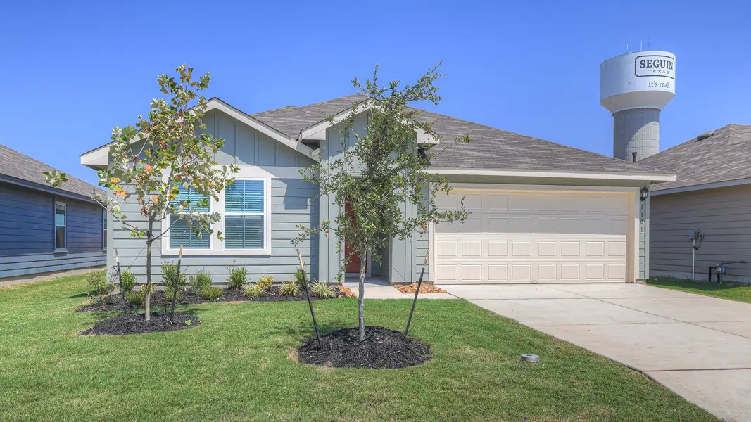 Front exterior of a new home in Navarro Fields, Seguin, TX, highlighting curb appeal (Image 2).