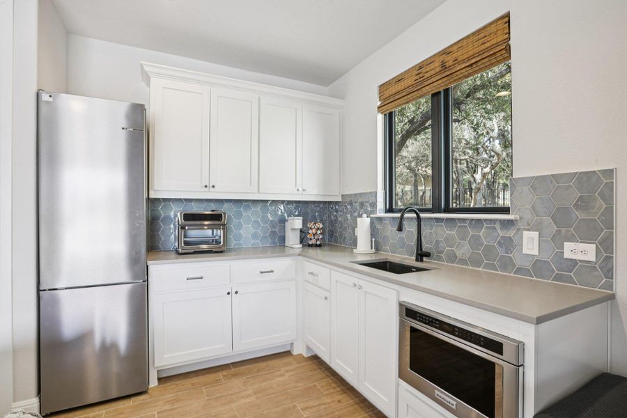 A detached pool casita offers its own living space, kitchenette, and full bath adding convenience and autonomy for guests.