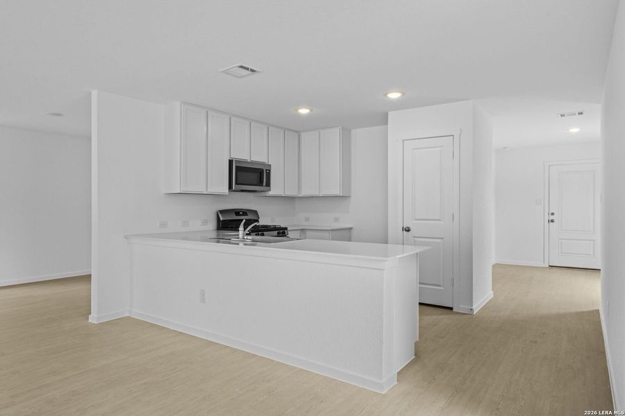 Furnished interior view inside a new home in Waterwheel, San Antonio (Image 6).