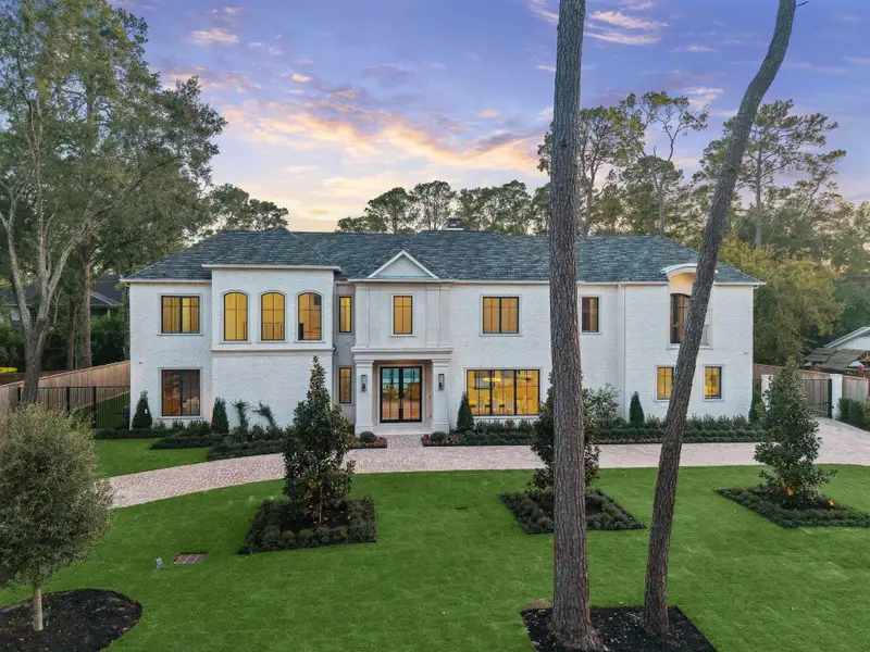 This elegant two-story residence sits on over half an acre lot with 3 car garage.