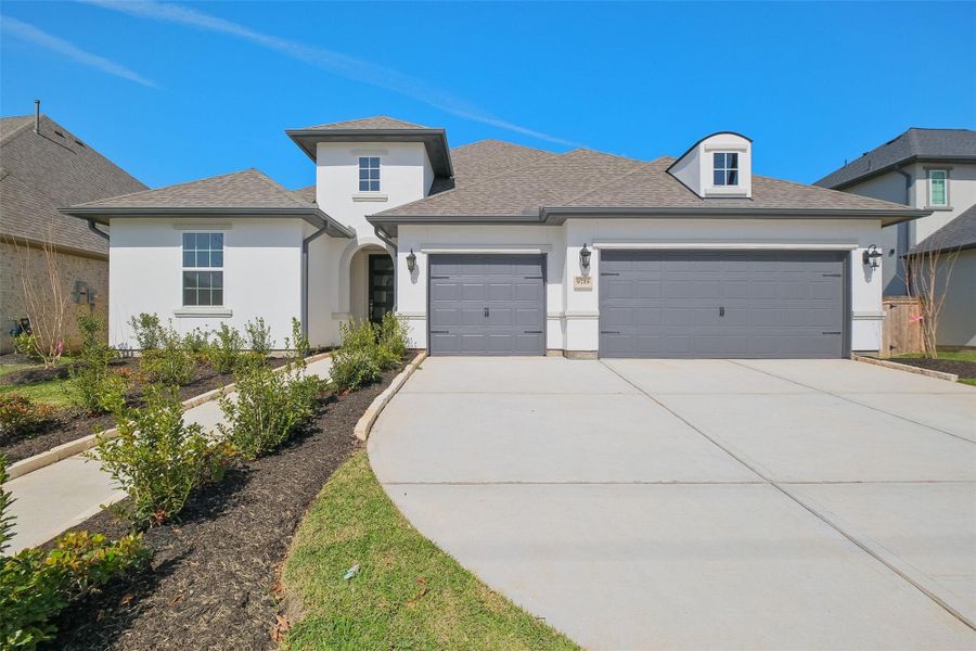 Front exterior of a new home in Sienna 65', Missouri City, TX, highlighting curb appeal (Image 2). Front exterior of a new home in Sienna 65', Missouri City, TX, highlighting curb appeal (Image 2).