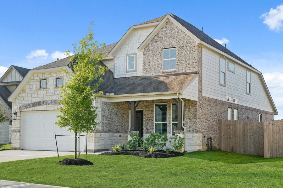 Front exterior of a new home in Beacon Hill, Waller, TX, highlighting curb appeal (Image 16). Front exterior of a new home in Beacon Hill, Waller, TX, highlighting curb appeal (Image 16).