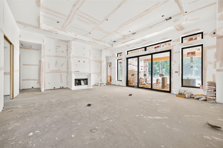 Full view of family room with additional floor outlets. Pool bath entry located past the sliding glass doors.
