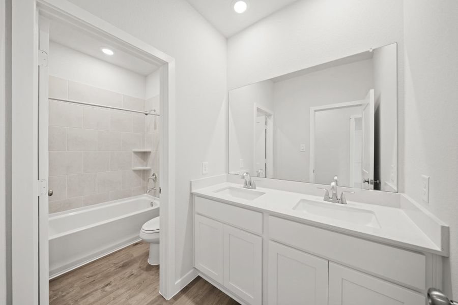 Furnished interior view inside a new home in Creekland Village at Bridgeland, Cypress (Image 9).