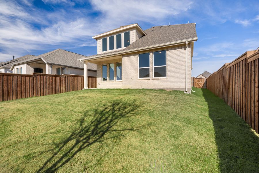 Exterior details and patio area of a home in Reunion, Rhome (Image 21). Exterior details and patio area of a home in Reunion, Rhome (Image 21).
